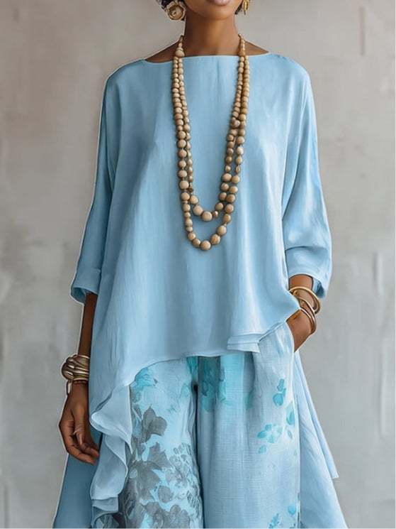 Top Asimmetrico Blu e Pantaloni Largo a Fiori