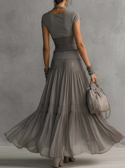 Top Grigio in Pizzo Trasparente e Set di Gonna Maxi Plissettata