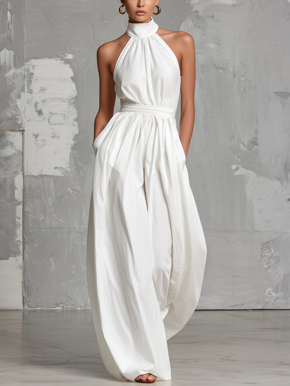 Zoltán | Elegante tuta bianca intrecciata senza maniche con collo a halter • S1