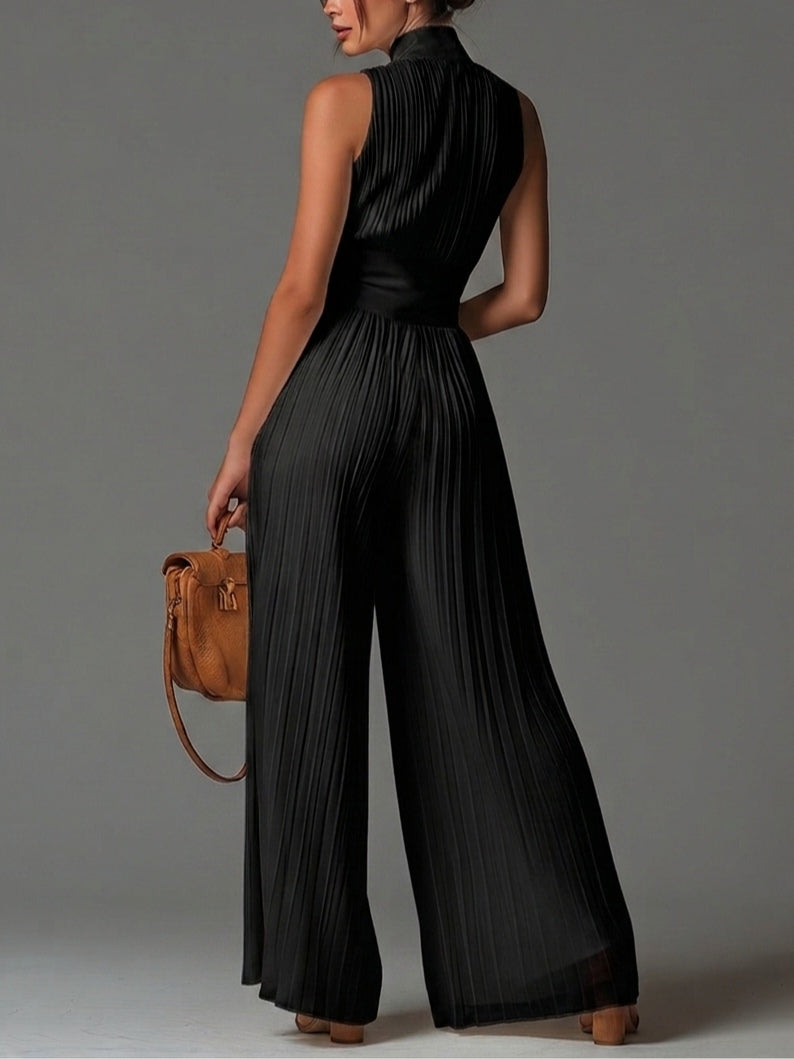 Tuta senza maniche nera con scollo a V, zip frontale e pieghe, gamba larga in chiffon