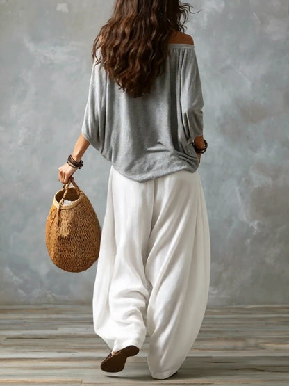 Top Grigio Off-shoulder e Pantaloni Lantern Bianchi Svasati