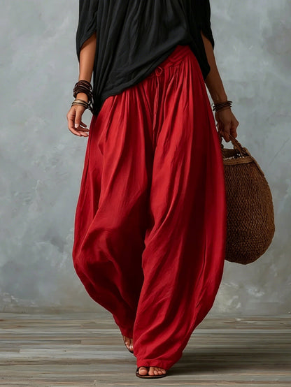 Top Nero Off-Shoulder e Pantaloni Lantern Rossi a Vestibilità Larga