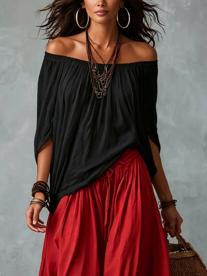 Top Nero Off-Shoulder e Pantaloni Lantern Rossi a Vestibilità Larga