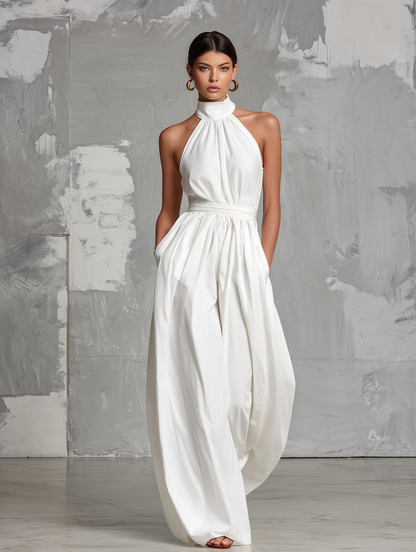 Zoltán | Elegante tuta bianca intrecciata senza maniche con collo a halter • S1